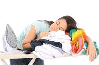 photo of woman asleep on ironing